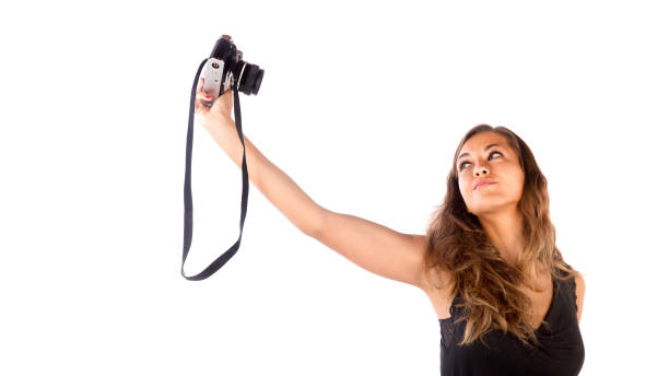 istock Pretty happy girl taking a selfie with camera 1127640829