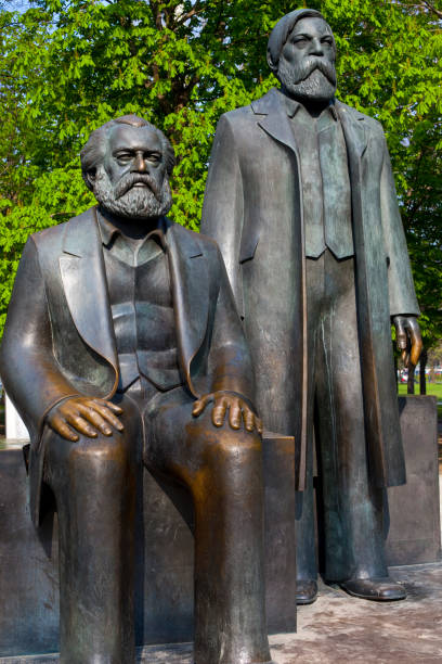 Karl Marx and Friedrich Engels Statue in Berlin Berlin, Germany - April 17th 2011: Statue of Karl Marx and Friedrich Engels located in Marx-Engels-Forum in the city of Berlin, Germany.  Marx and Engels were the authors of the Communist Manifesto of 1848. friedrich engels stock pictures, royalty-free photos & images