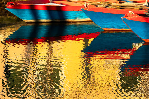 A view from the top of a boat in a venetian canal.