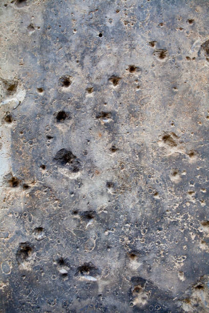 A close-up of bullet holes created during the Battle of Berlin near the end of the Second World War, in Berlin, Germany.