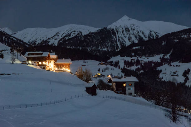 istock little village in the alps at night 1127642185