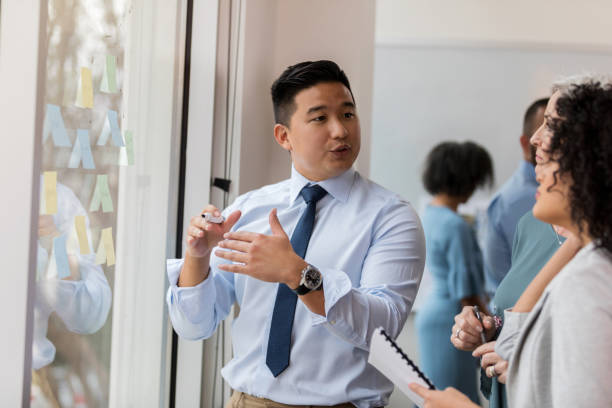 istock Young businessman presents ideas 1127642895