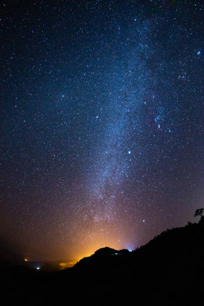 istock night sky stars milky way on mountains background 1127642986