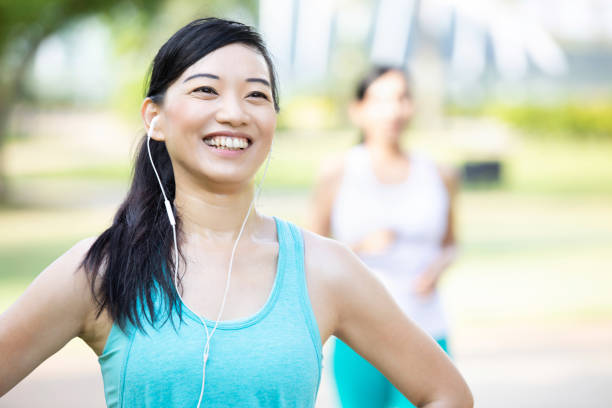 istock Confident woman exercises in the park 1127643179