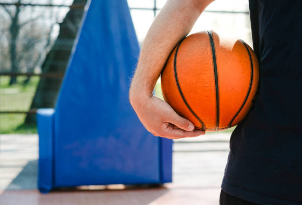 istock Man holds the ball for basketball 1127643426