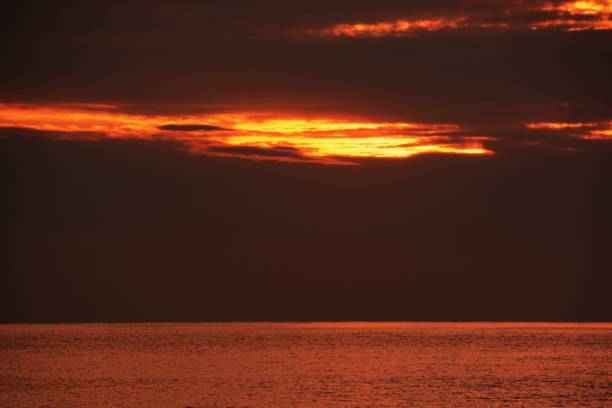 istock The sunrise is shining on the beach 1127644273