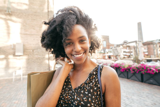 istock Young woman with shopping bag 1127651167