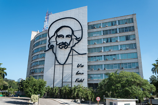Ministry of Communications with image of Camilo Cienfuegos one of the most important heroes of the Cuban revolution. Havana. Cuba. January 2, 2017
