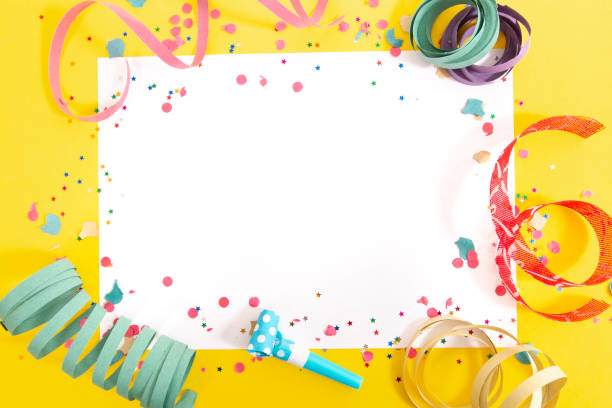 istock carnival confetti on white paper 1127657001