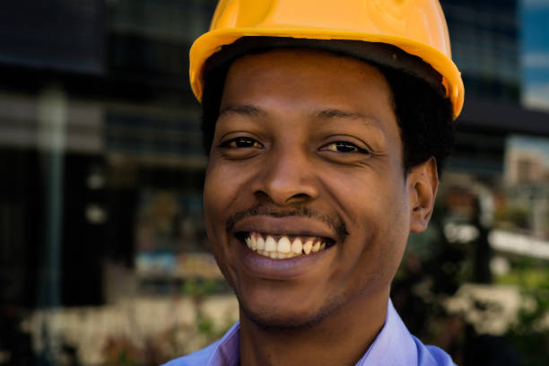 istock Portrait of Afro american architect in hard hat 1127660412