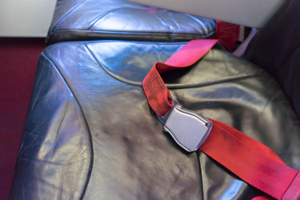 istock Close-up of fastening security belt in airplane.selective focus.copy space 1127661376