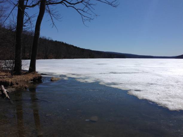 istock Frozen lake in the winter 1127672932