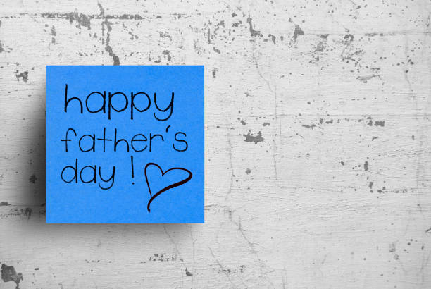 istock Sticky note on concrete wall, Happy Father's Day 1127673785