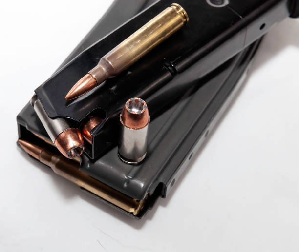 istock Two magazines, one for a pistol and one for a rifle both loaded with bullets 1127673851