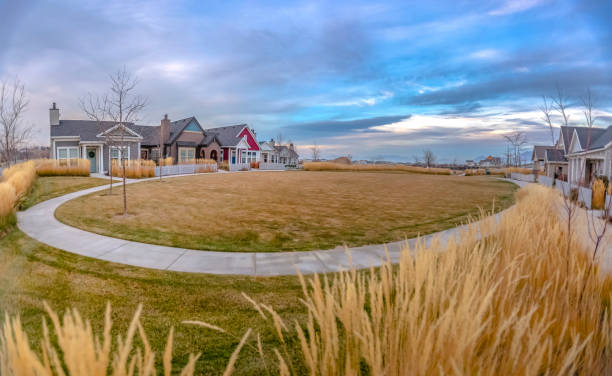 istock Homes around lawn with circular path in Daybreak 1127676617
