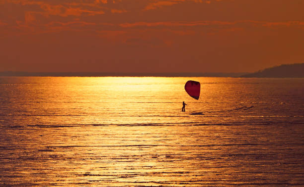 istock A snowkiter on the St-Lawrence river at sunset 1127680622