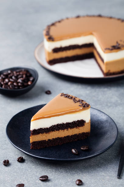 istock Caramel cake, mousse dessert on a plate. Grey stone background. 1127685255
