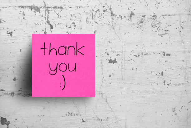 istock Sticky note on concrete wall, Thank you 1127685343