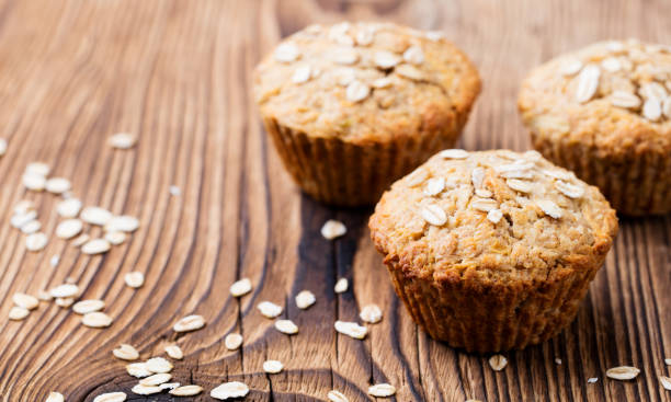 Healthy vegan oat muffins, apple and banana cakes on a wooden background. Copy space. Healthy vegan oat muffins, apple and banana cakes on a wooden background. Copy space easter cake photos stock pictures, royalty-free photos & images