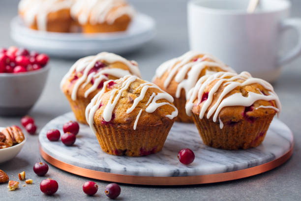 istock Muffins, cakes with cranberry and pecan nuts. Close up. 1127685555