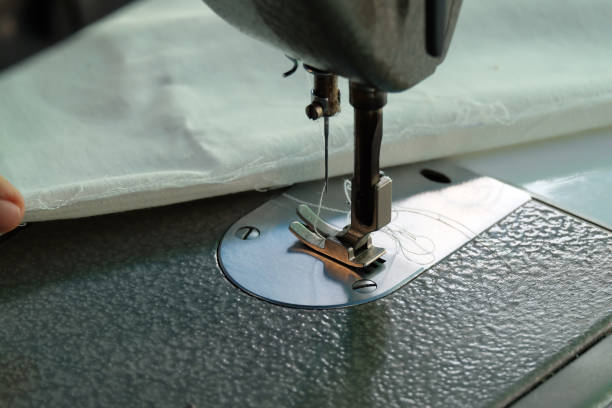 istock sewing machine,Close up - electric sewing machine. 1127686262