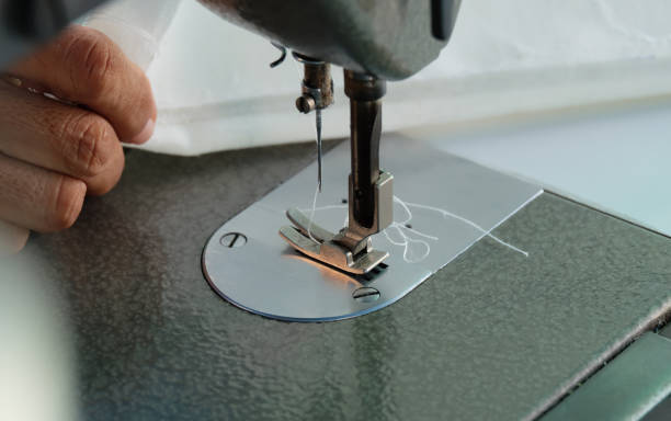 istock sewing machine,Close up - electric sewing machine. 1127686264