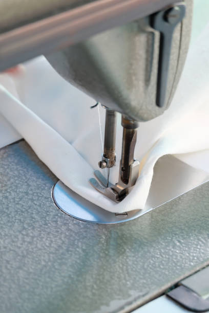 istock sewing machine,Close up - electric sewing machine. 1127686303