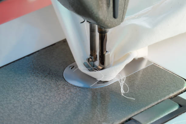 istock sewing machine,Close up - electric sewing machine. 1127686309