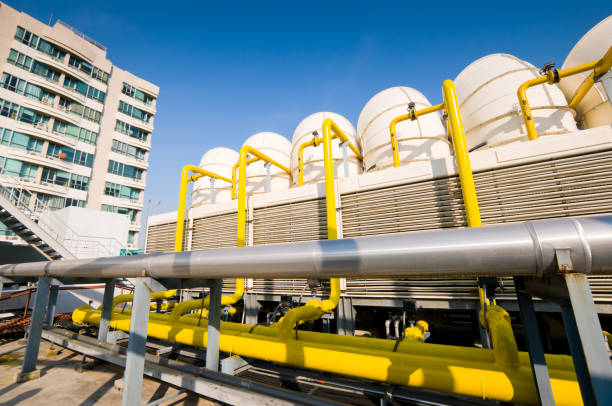 istock Rooftop cooling tower unit with chiller units and compressors in large building 1127687473
