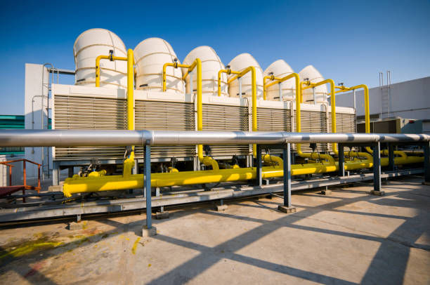 istock Rooftop cooling tower unit with chiller units and compressors in large building 1127687502