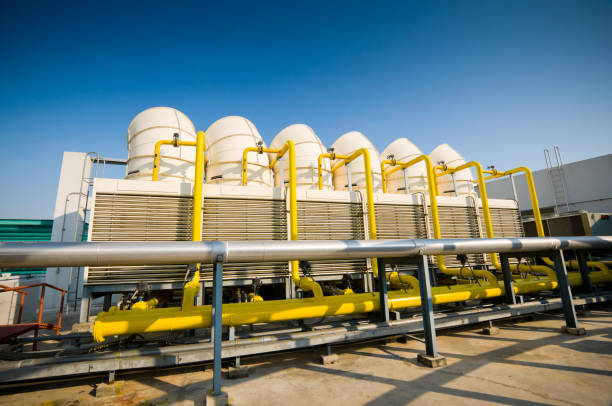 istock Rooftop cooling tower unit with chiller units and compressors in large building 1127687519