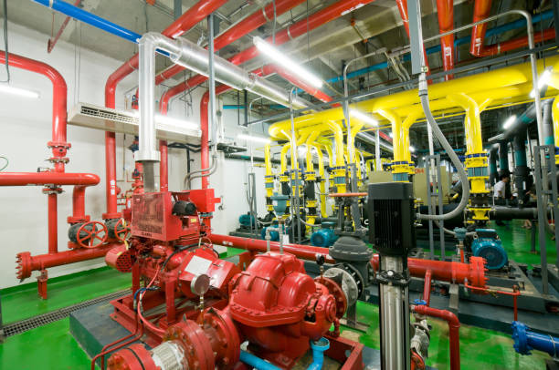 istock Pumping station and Electrical power generator  industrial interior pipes line in large building 1127687532