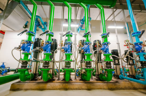 istock Pumping station and Electrical power generator  industrial interior pipes line in large building 1127687547
