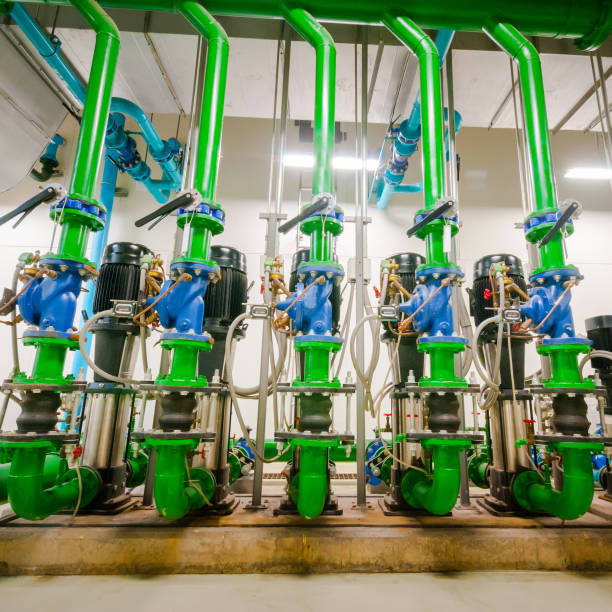 istock Pumping station and Electrical power generator  industrial interior pipes line in large building 1127687559