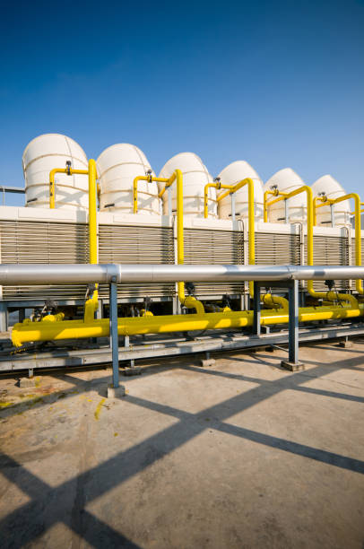 istock Rooftop cooling tower unit with chiller units and compressors in large building 1127688397