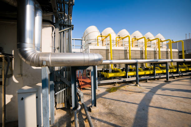 istock Rooftop cooling tower unit with chiller units and compressors in large building 1127688405