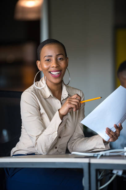 istock Successful businesswoman working at her desk 1127688516