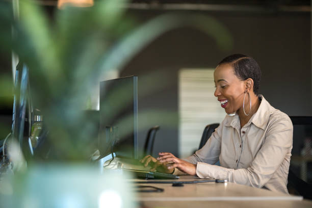istock Successful businesswoman working at her desk 1127688567