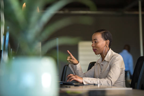 istock Successful businesswoman working at her desk 1127688570
