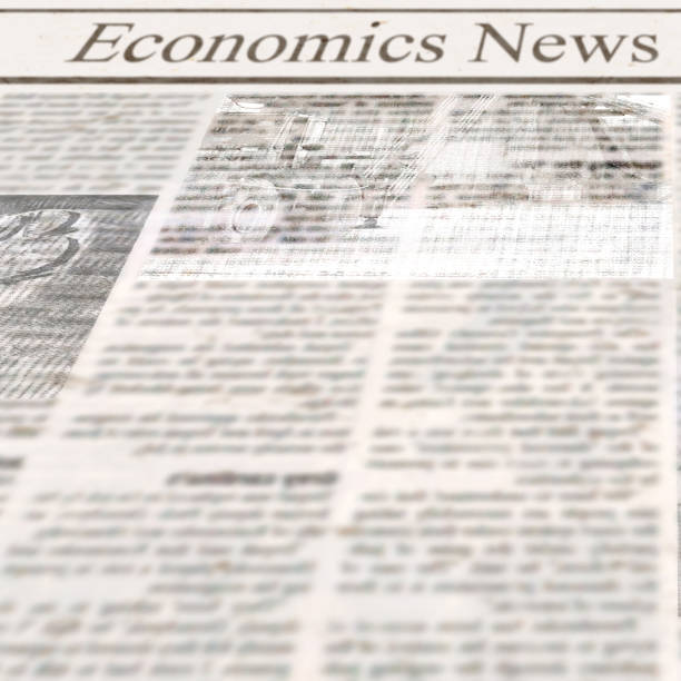 istock Newspaper with headline Economics News and old unreadable text 1127688678