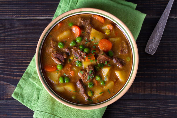 Traditional Irish lamb stew with vegetables Traditional Irish lamb stew with vegetables. View from above, top studio shot beef stew stock pictures, royalty-free photos & images