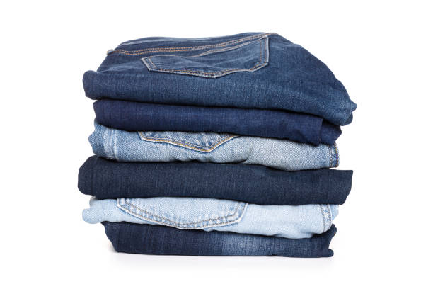 istock A stack of clothes jeans pants on a white background. Isolation 1127693652