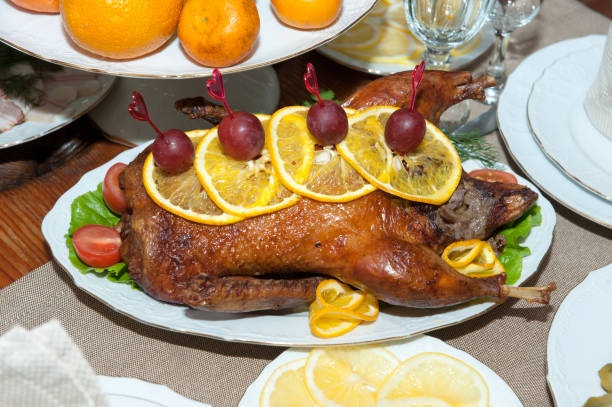 istock Fried chicken served with oranges and grapes on a plate 1127696480
