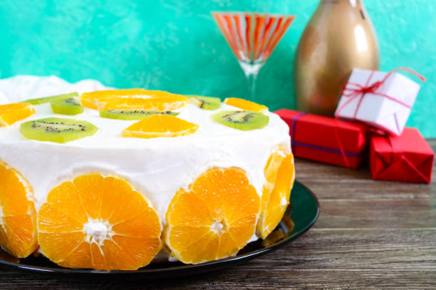 istock Delicious fruit cake on a wooden table. Festive cake. 1127696496