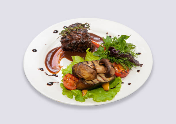 Sliced sirloin steak with sauteed french beans cherry tomatoes and herb-mustard sauce.THIS IMAGE IS ONLY AVAILABLE HERE AT ISTOCKPHOTO