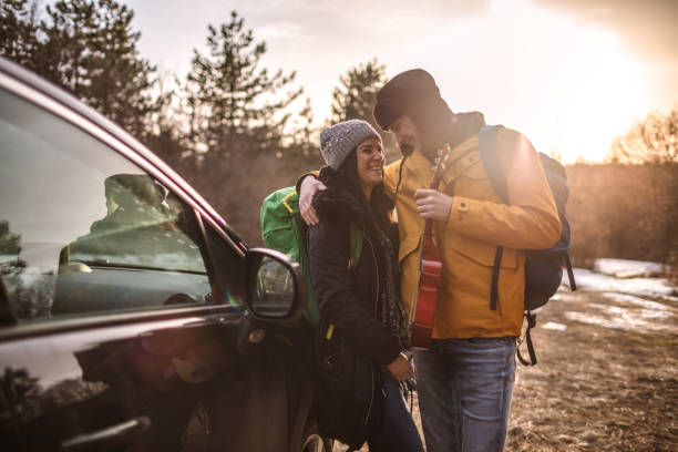 istock Yong couple with guitar in nature 1127696735