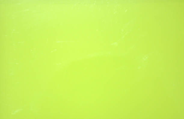 istock Yellow glossy monophonic background. Metallic. Texture. Close-up shot. 1127696844