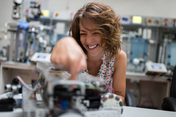 istock Smiling lady in laboratory have fun 1127701889