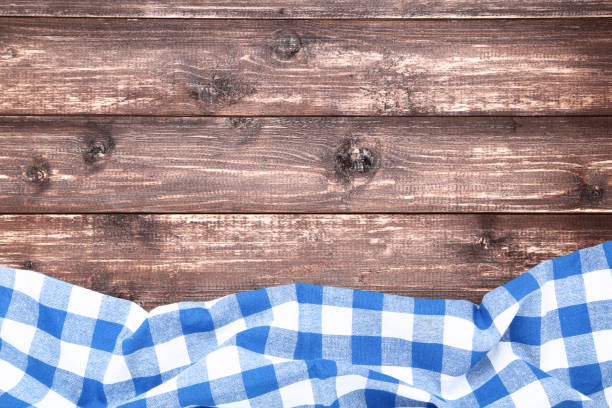 istock Blue napkin on brown wooden table 1127703073