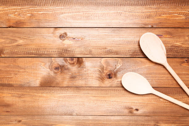 istock Wooden kitchen spoons on brown table 1127703760
